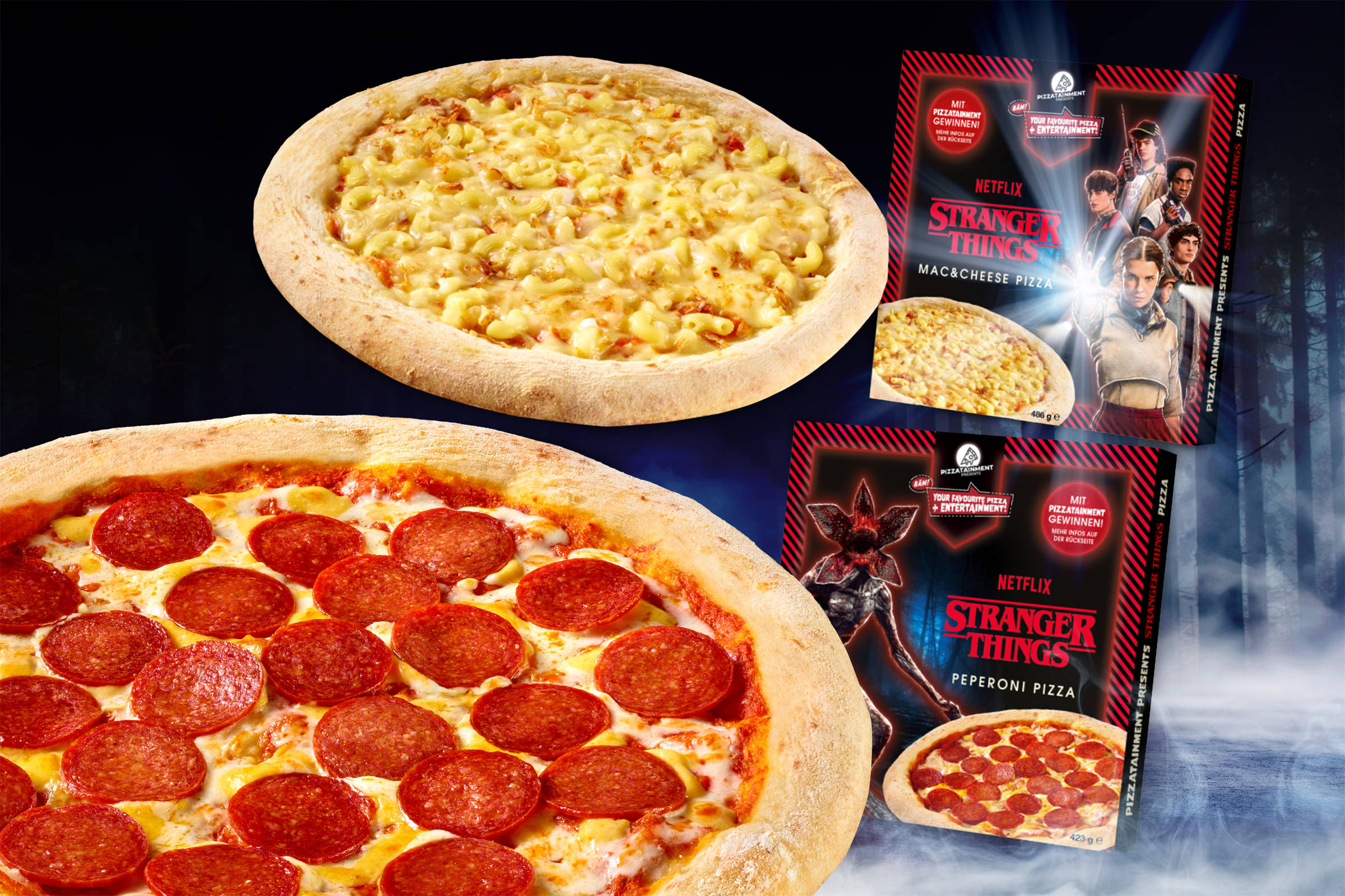 freiberger: 2 Pizza-Verpackungen sowie die ausgepackten Pizzen zur Netflix-Serie Stranger Things. Vor einem unheimlichen Motiv (Wald mit Nebel). Mac & Cheese Pizza und Peperoni Pizza.